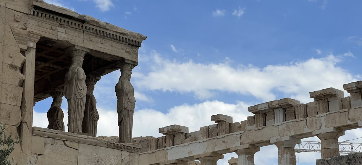A building with columns and statues A building with columns and statues