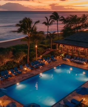 Sunset over the tranquil pool at the beach club, Westin Kapalua Resort, creating a serene and picturesque atmosphere.