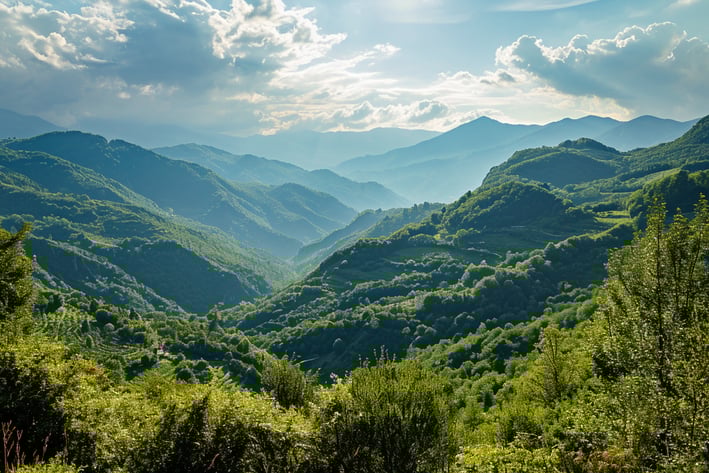 a wide shot of Garfagnana— a lush valley between the Apuan Alps and the Tuscan-Emilian Apennines.