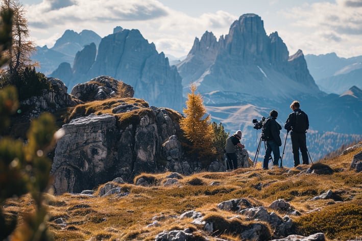 A group of birdwatchers setting up equipment at the Italian Dolomites during fall.