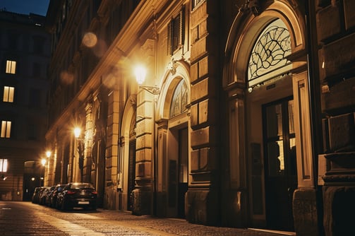 an establishing shot of a luxury hotel in the city of florence at night.
