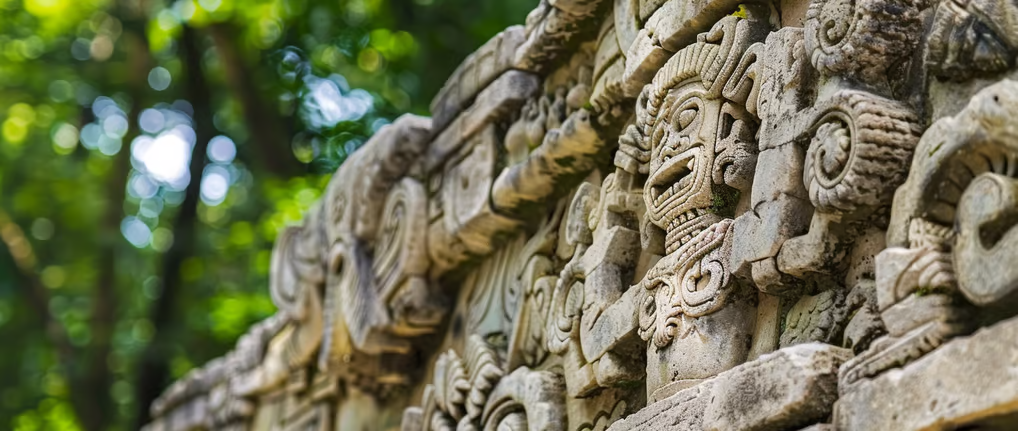 intricate Mayan carvings on a stone stela at Copán intricate Mayan carvings on a stone stela at Copán