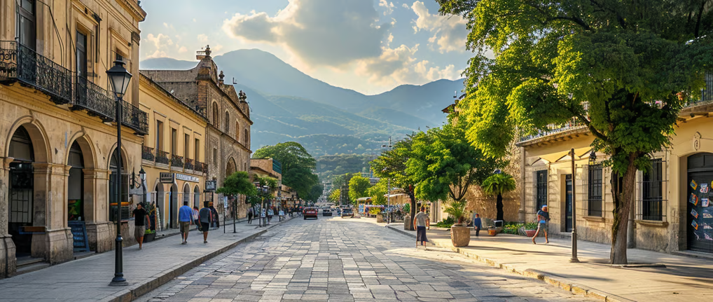 a street scene with a street light and a mountain in the background in mexico