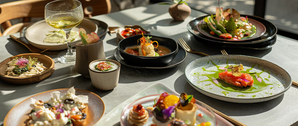 a table with plates of food and drinks a table with plates of food and drinks