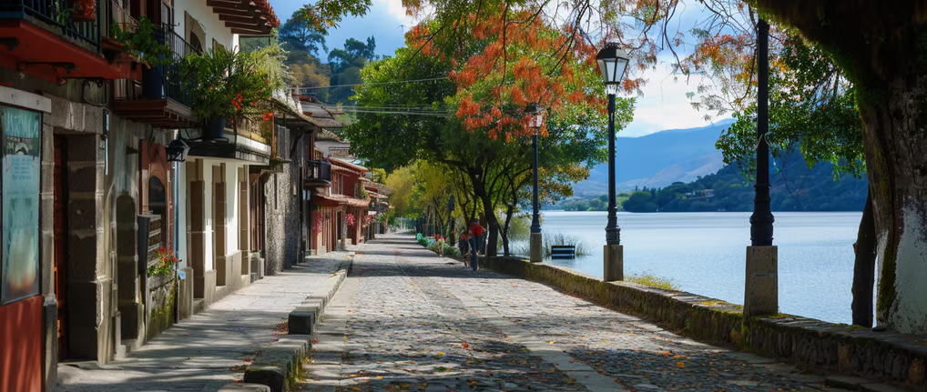 a street with a bench in front of a lake in mexico a street with a bench in front of a lake in mexico