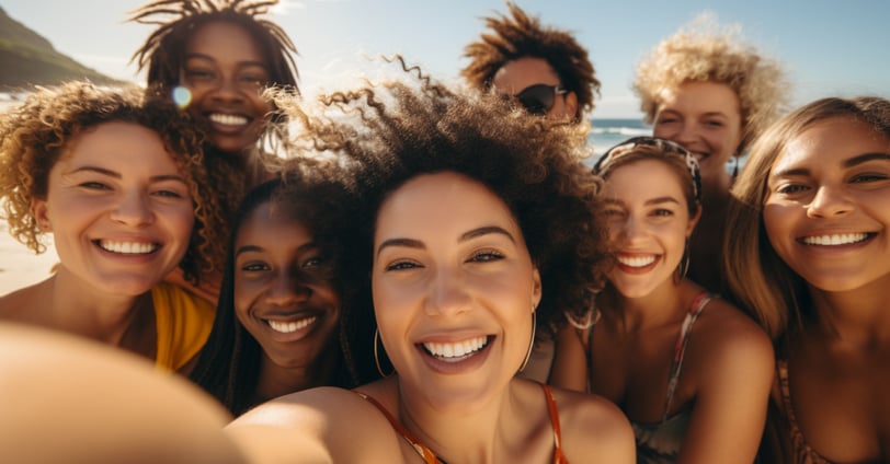a group of women taking a selfie by the beach a group of women taking a selfie by the beach
