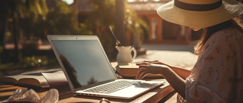 a woman in a hat in front of a laptop a woman in a hat in front of a laptop