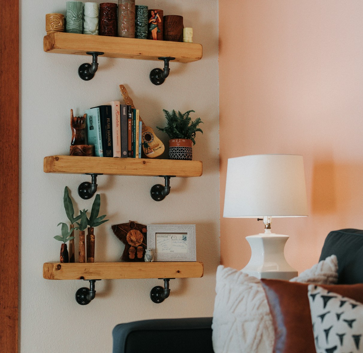 a living room filled with furniture and a lamp