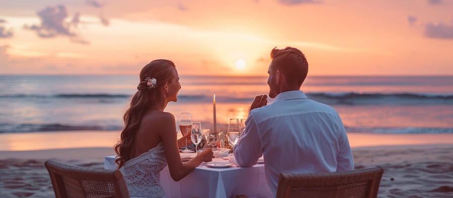 newlyweds having a romantic beach side dinner in Bali