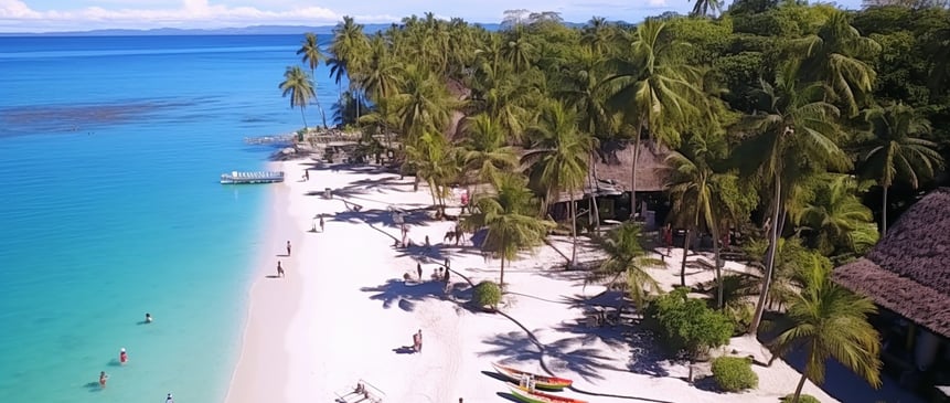 a Philippine island beach with a boat and people on the water