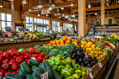 Stacked produce in an indoor winter market in Maple Ridge, Canada.