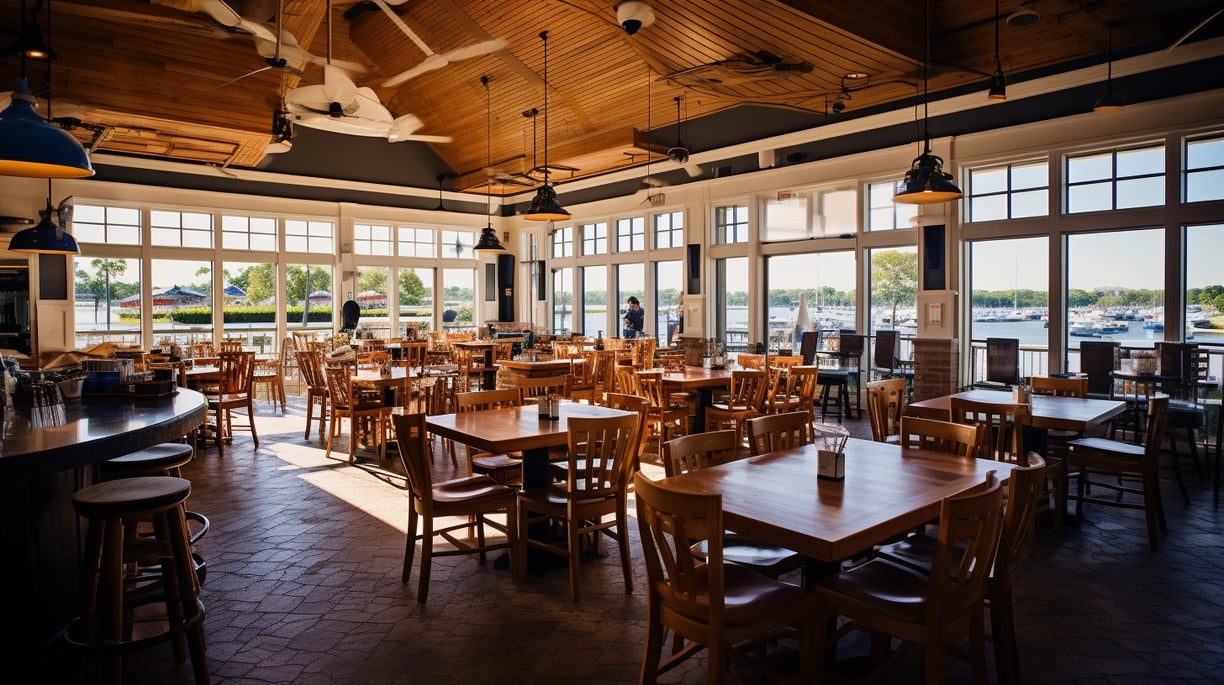 a restaurant with a large window and a ceiling fan