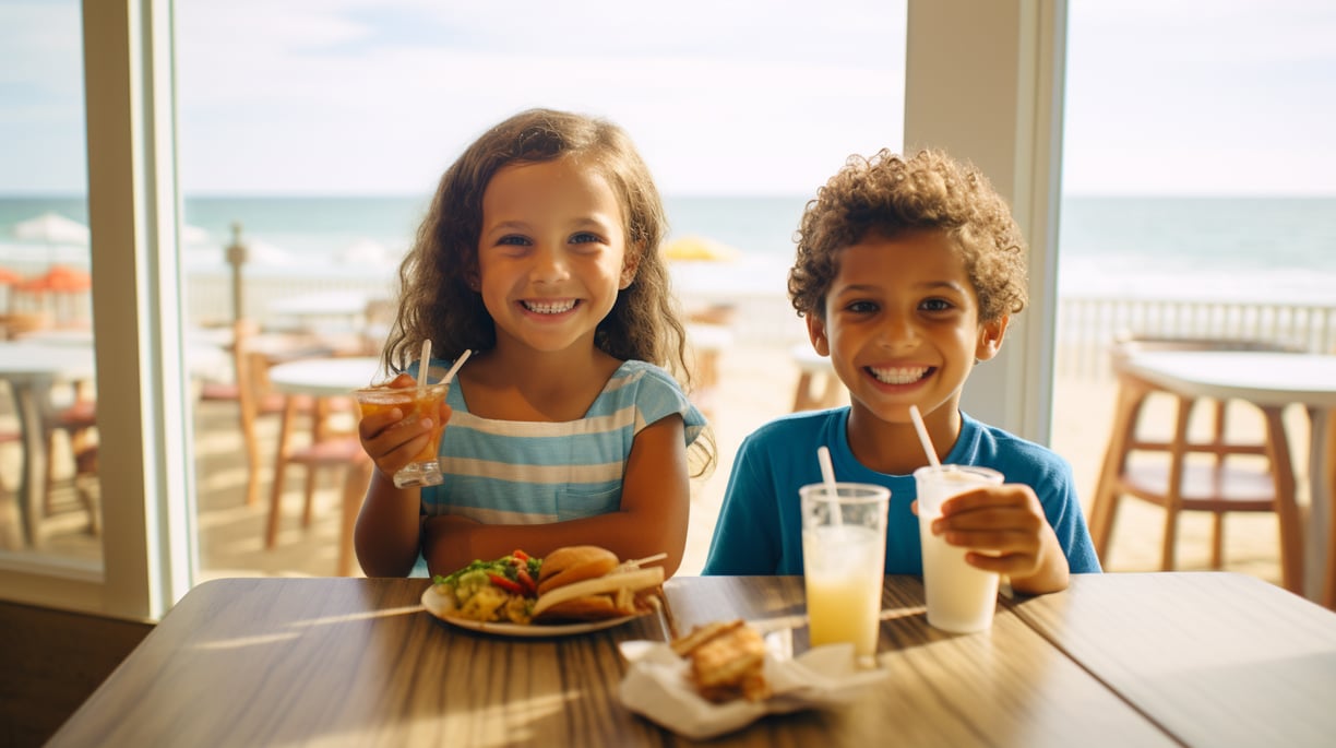 two kids eating at a beachfront eatery in virginia beach