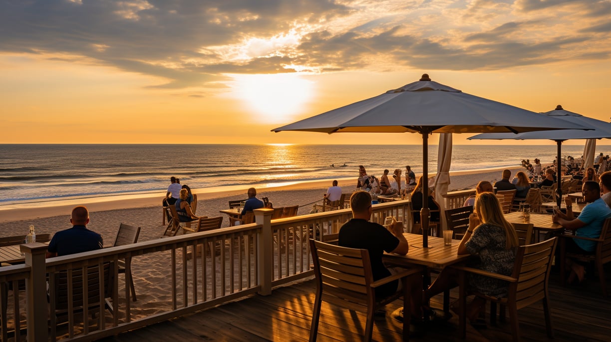 a group of people sitting at beachfront dining tables at Sandbridge Beach
