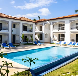 A large house with a pool and lawn chairs in puerto plata, dominican republic A large house with a pool and lawn chairs in puerto plata, dominican republic