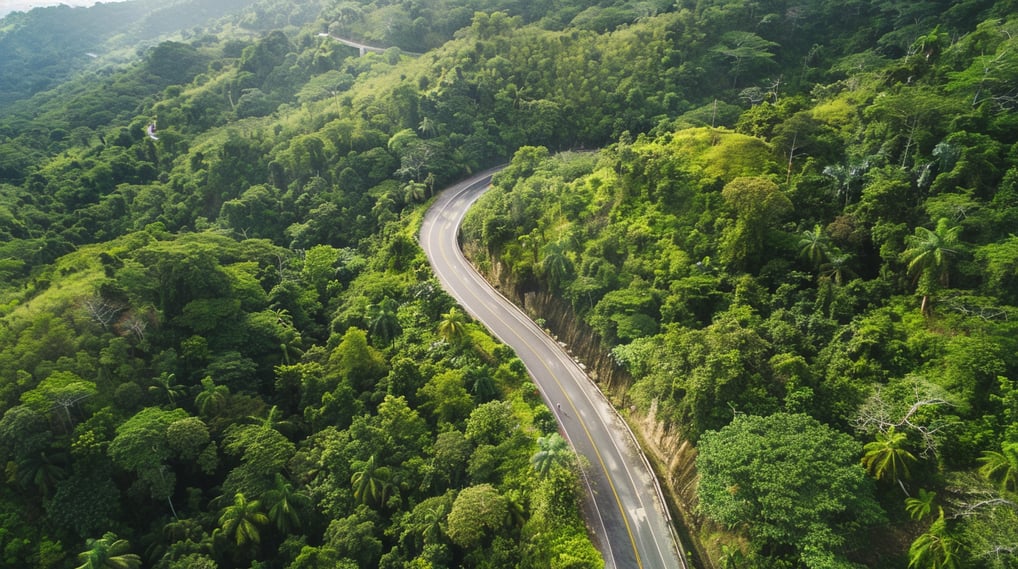a road with a car driving down a mountain a road with a car driving down a mountain