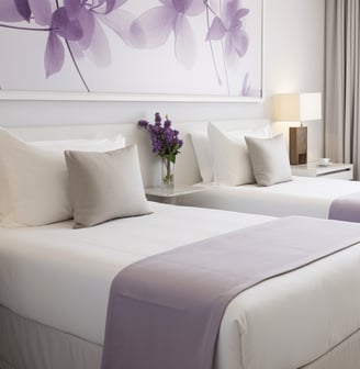 a bedroom with two beds and a chair a bedroom with two beds and a chair