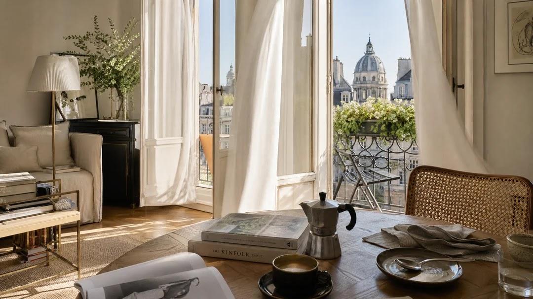Bright apartment interior with open balcony doors, reflecting the atmosphere of Barcelona neighborhoods.