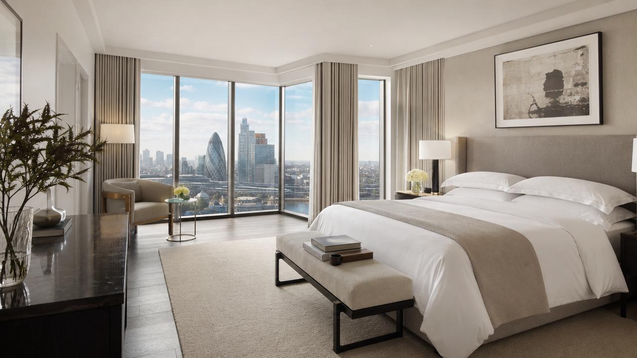 Bright luxury apartment bedroom overlooking London, representing luxury aparthotels in London.
