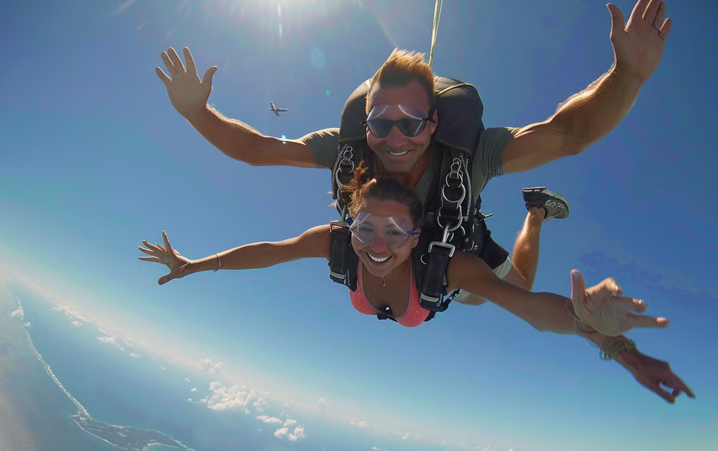 a couple skydiving and mid-descent.