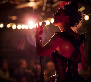A lady tourist partying at an Ibiza beach at night.