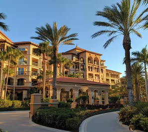the exterior of a plush Florida hotel at noon.